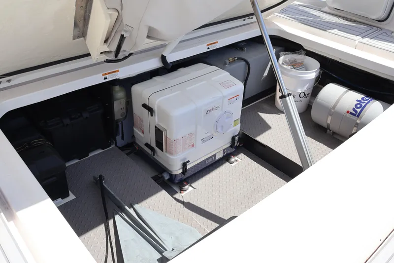 Slide: The Image of 2022 Regal 38 SAV engine compartment with generator and storage items. - 28