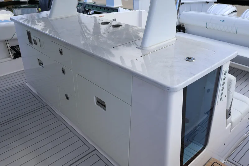 Slide: The Image of 2022 Regal 38 SAV boat interior with sleek white cabinetry and modern design. - 49