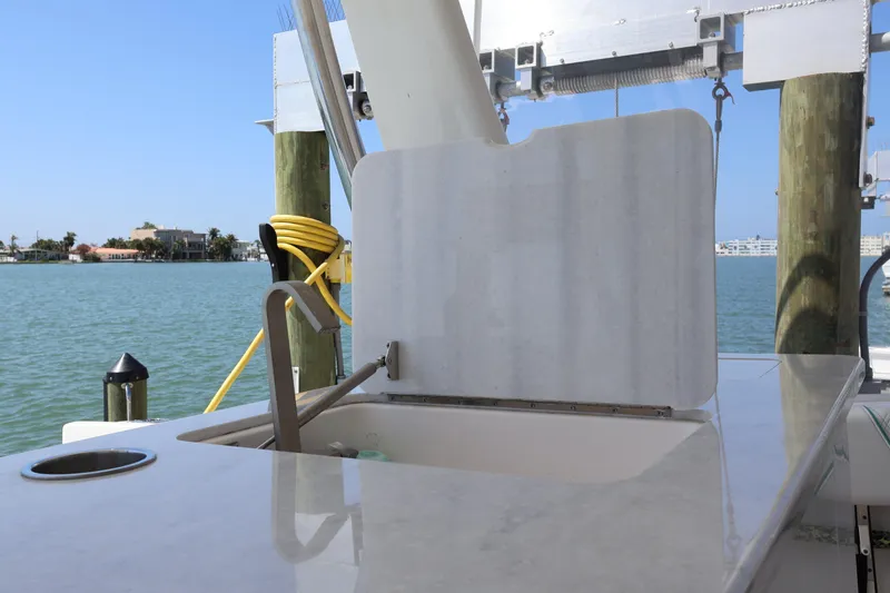 Slide: The Image of 2022 Regal 38 SAV boat with open deck and water view. - 52