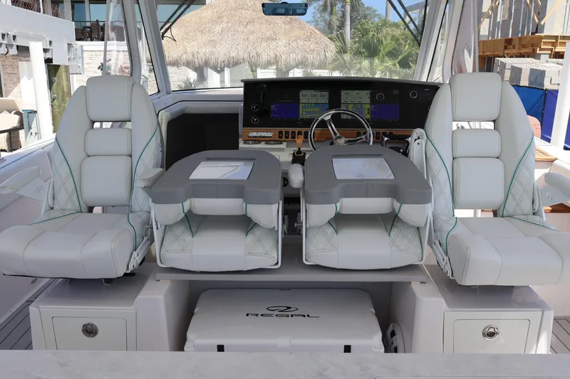 Slide: The Image of 2022 Regal 38 SAV boat interior with modern helm and luxurious seating. - 60