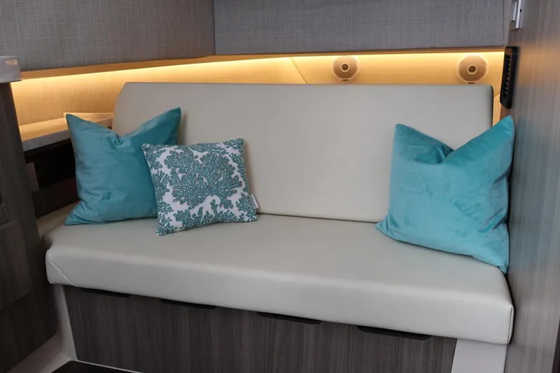Slide: The Image of Interior of 2022 Regal 38 SAV yacht with elegant seating and decorative pillows. - 77