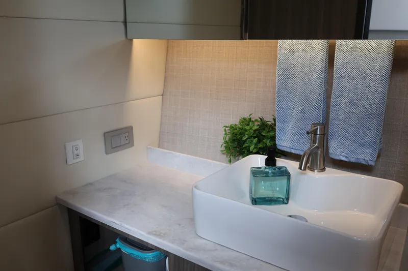 Slide: The Image of Modern bathroom sink in 2022 Regal 38 SAV yacht, featuring elegant design and accessories. - 83