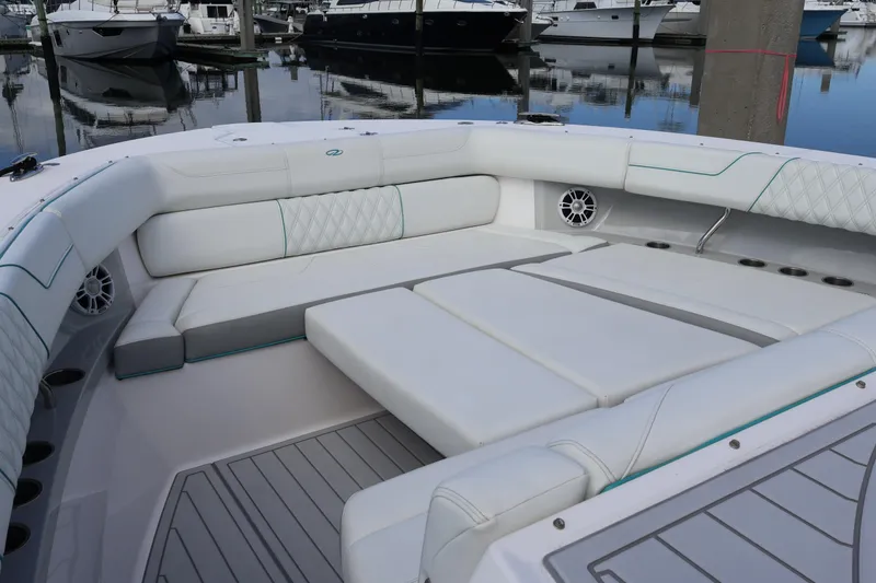 Slide: The Image of Luxurious seating area on 2022 Regal 38 SAV boat, docked at marina. - 86
