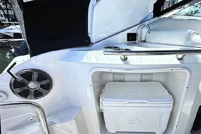Slide: The Image of 2022 Regal 28 Express boat interior with cooler and speaker. - 11