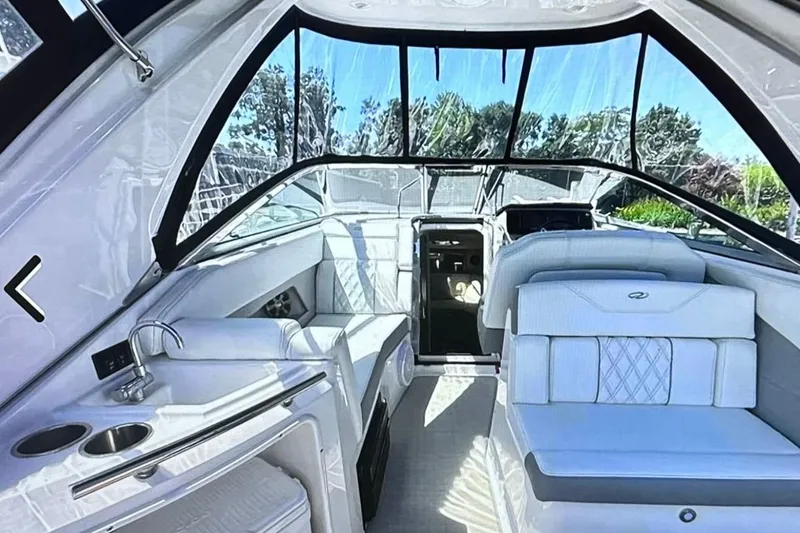 Slide: The Image of 2022 Regal 28 Express boat interior with luxurious seating and modern amenities. - 12