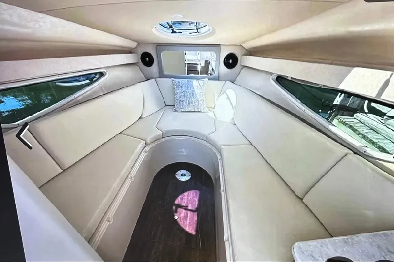 Slide: The Image of 2022 Regal 28 Express cabin interior with beige seating and modern design. - 13