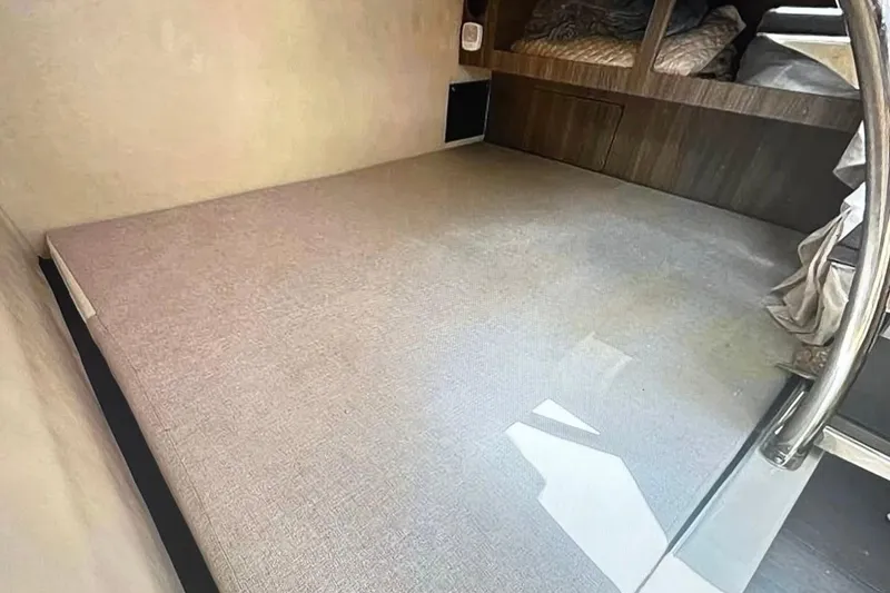 Slide: The Image of Interior cabin of 2022 Regal 28 Express boat with cozy sleeping area. - 15