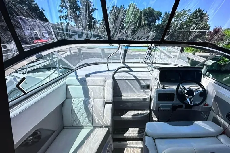 Slide: The Image of 2022 Regal 28 Express boat interior with modern helm and seating. - 9