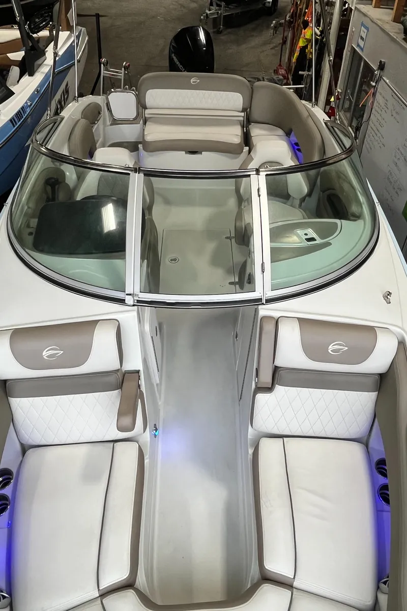 Slide: The Image of 2023 Crownline Eclipse E235 XS boat interior with plush seating and modern design. - 16
