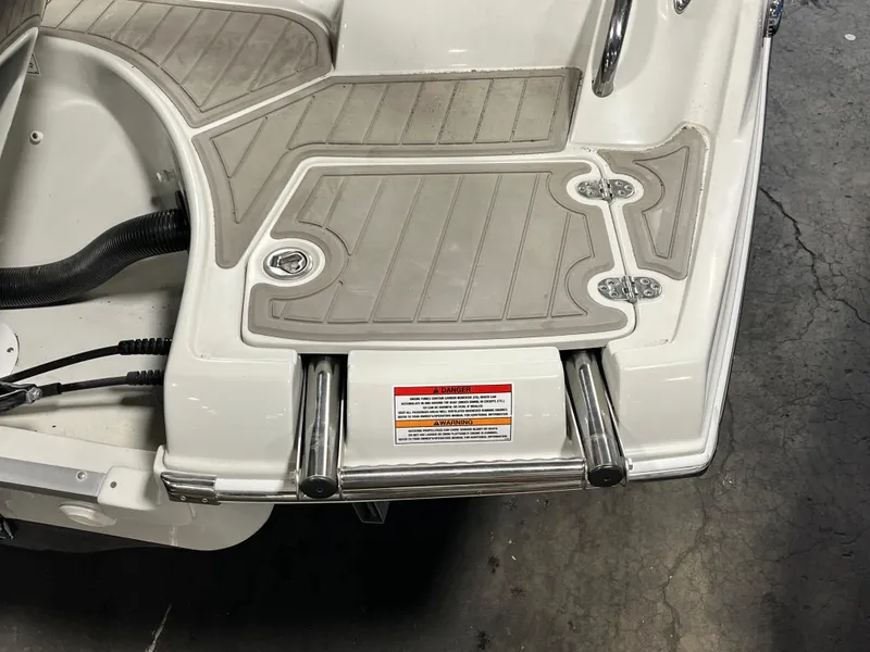Slide: The Image of 2023 Crownline Eclipse E235 XS boat swim platform with ladder. - 4