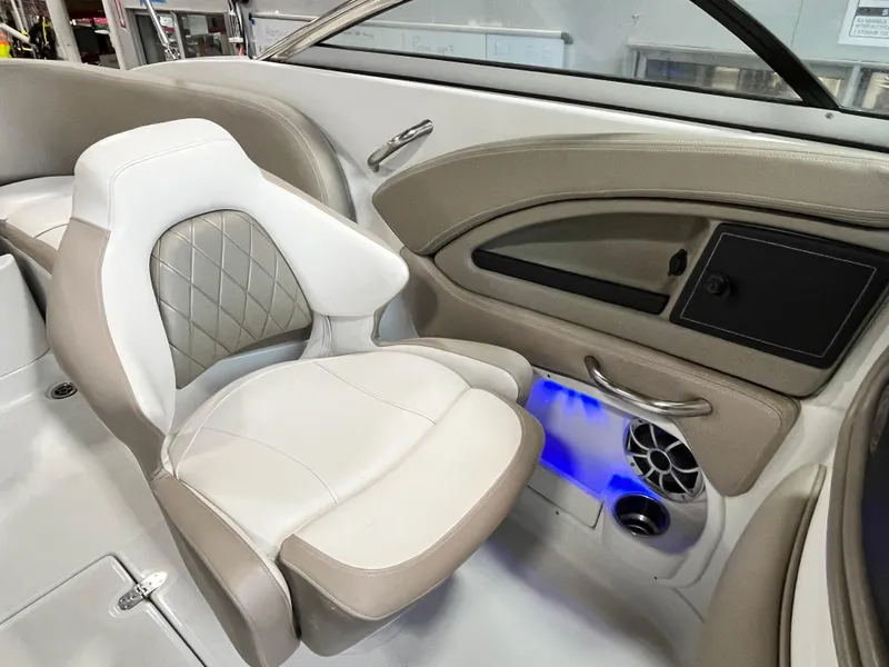 Slide: The Image of 2023 Crownline Eclipse E235 XS boat interior with luxurious seating and modern dashboard. - 5