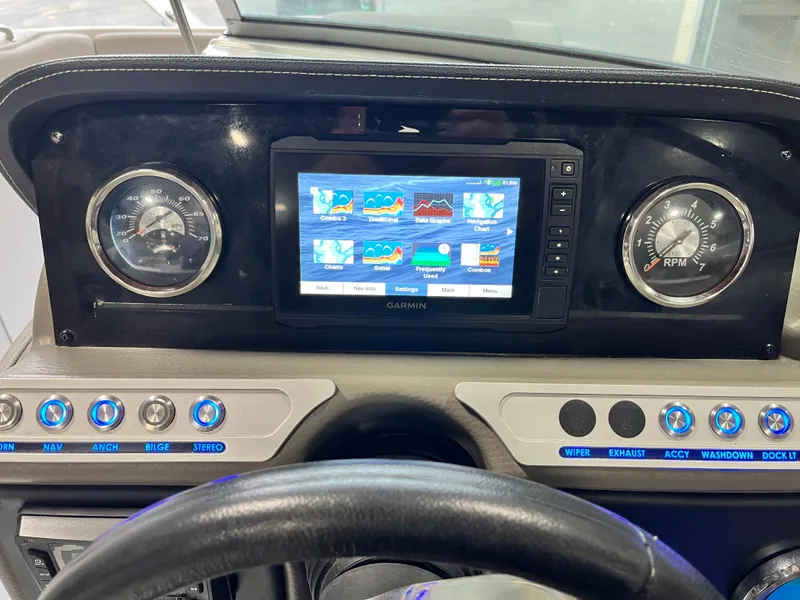 Slide: The Image of Dashboard of 2023 Crownline Eclipse E235 XS with Garmin display and gauges. - 7