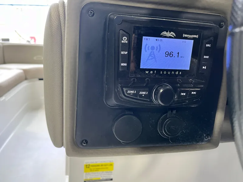 Slide: The Image of 2023 Crownline Eclipse E235 XS boat stereo system displaying FM radio station 96.1. - 8