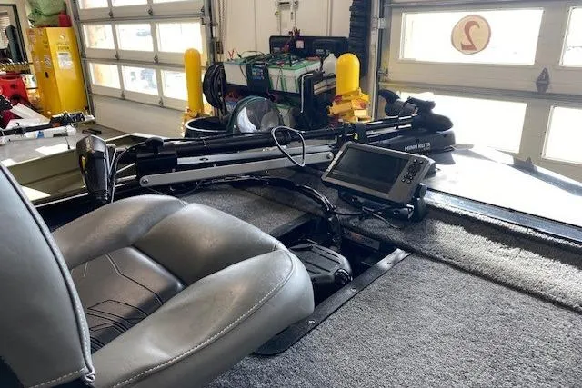 Slide: The Image of 2025 Tracker Pro 170 boat interior with steering console and navigation equipment. - 3