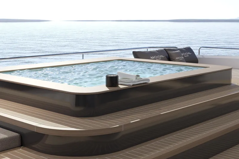 Slide: The Image of Luxurious Moon 9ty yacht deck with jacuzzi, ocean view, and elegant seating, 2027 model. - 32