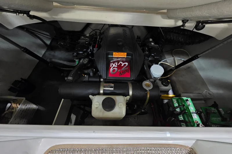 Slide: The Image of Engine compartment of a 2001 Cobalt 263 boat, featuring a MerCruiser 6.2 MPI engine. - 18