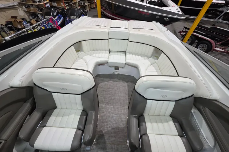 Slide: The Image of Interior of a 2001 Cobalt 263 boat with white and gray seating. - 7