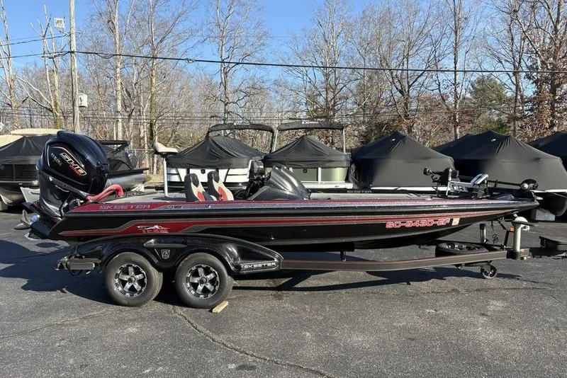 The Image of 2015 Skeeter FX20 bass boat on trailer, parked outdoors. - 0