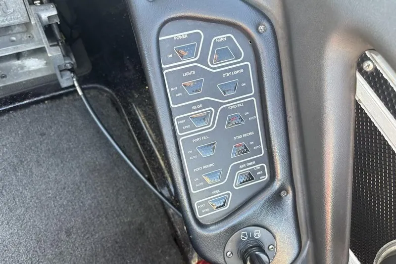 Slide: The Image of Control panel of a 2015 Skeeter FX20 boat with various switches and indicators. - 25