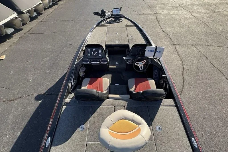 Slide: The Image of 2015 Skeeter FX20 boat interior with Lowrance electronics and dual seating. - 28