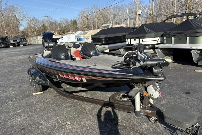 Slide: The Image of 2015 Skeeter FX20 bass boat on trailer in outdoor storage area. - 5
