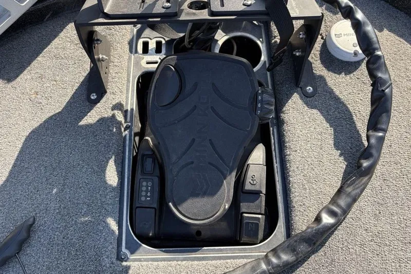 Slide: The Image of Foot pedal control on 2015 Skeeter FX20 boat deck, featuring various switches and controls. - 9