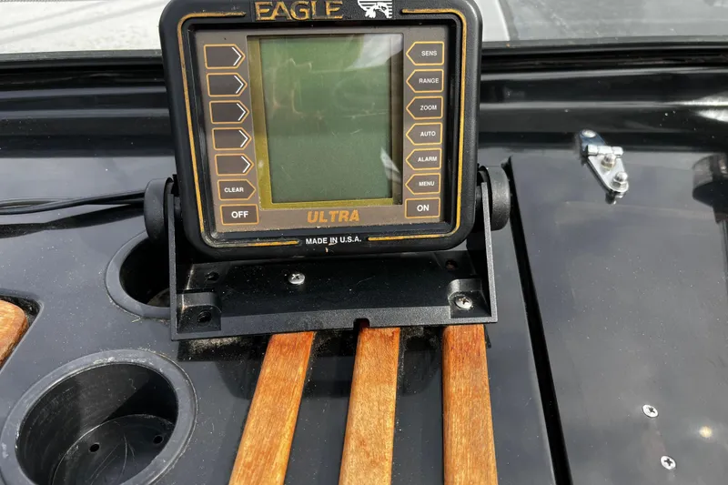 Slide: The Image of 1988 Mirage Manufacturing 217 Intruder with Eagle Ultra fish finder on dashboard. - 15