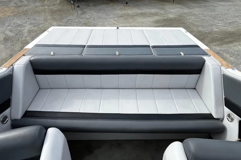 Slide: The Image of 1988 Mirage Manufacturing 217 Intruder boat interior with gray and black seating. - 7