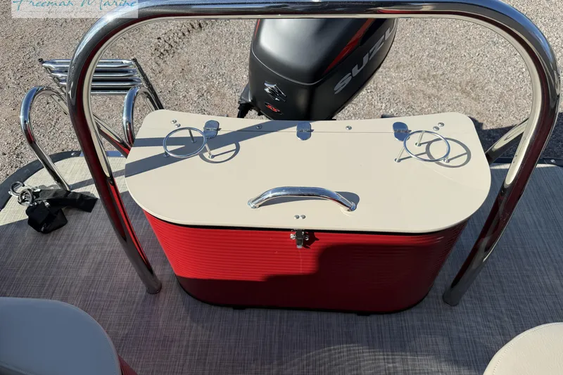 Slide: The Image of 2019 Avalon Catalina Quad Lounge boat interior with red storage and Suzuki motor. - 16