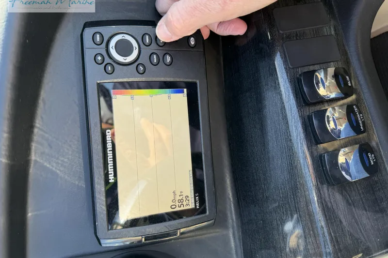 Slide: The Image of Close-up of a Humminbird Helix 5 fish finder on a 2019 Avalon Catalina Quad Lounge. - 28
