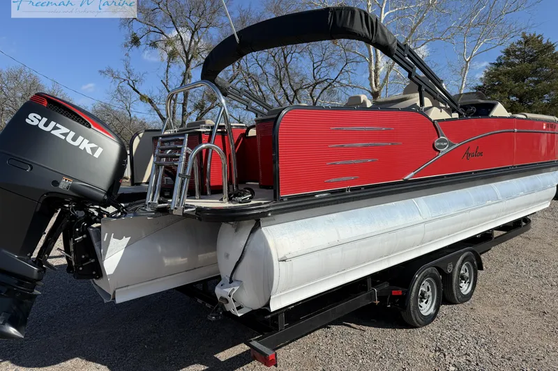 Slide: The Image of 2019 Avalon Catalina Quad Lounge 25' pontoon boat with Suzuki outboard motor on trailer. - 7