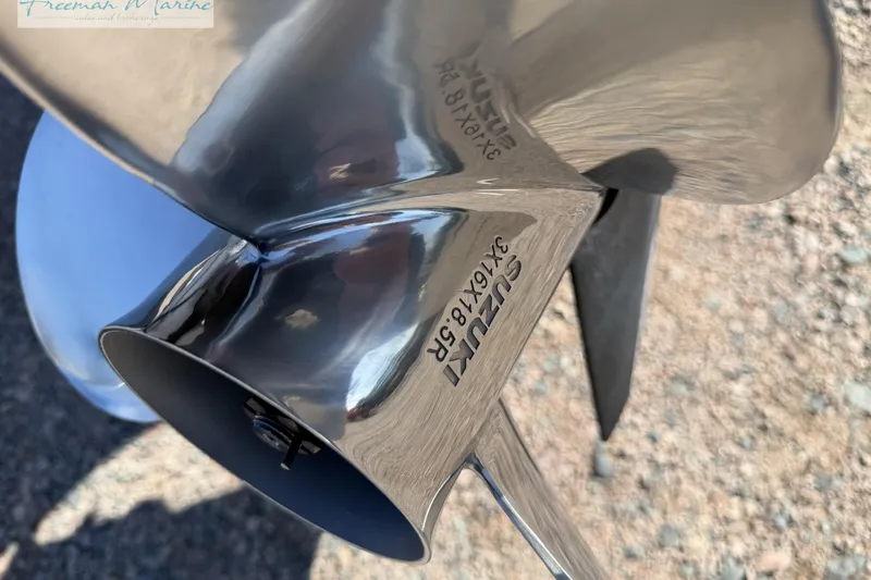 Slide: The Image of Close-up of a Suzuki boat propeller on a 2019 Avalon Catalina Quad Lounge. - 8
