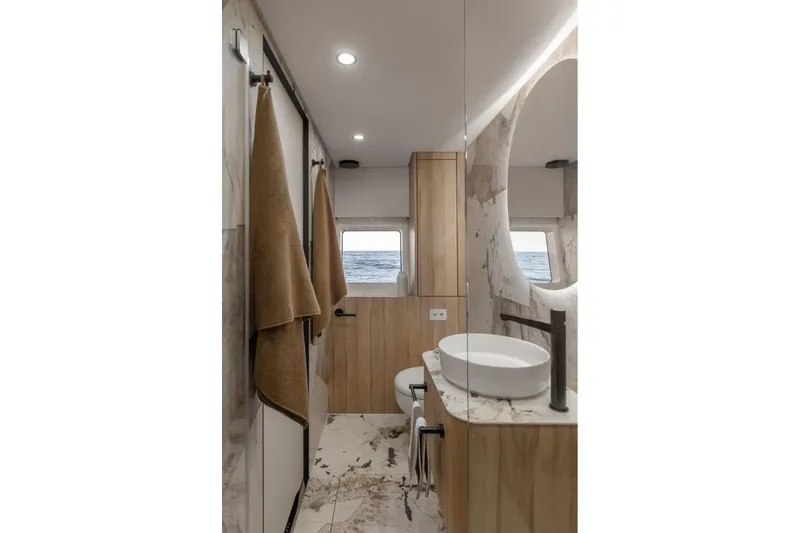 Slide: The Image of Luxurious bathroom interior of 2026 Moon Yachts 6ty, featuring modern fixtures and ocean view. - 20
