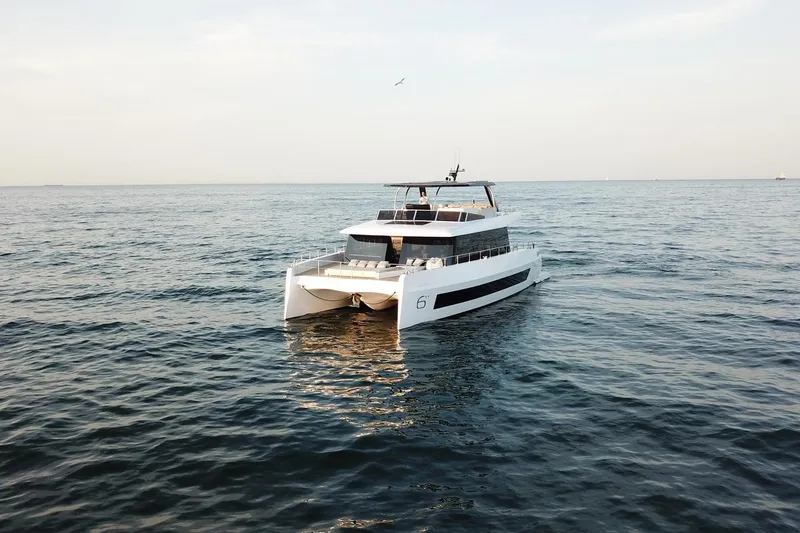 Slide: The Image of Luxury Moon Yachts 6ty 2026 model cruising on open sea. - 31