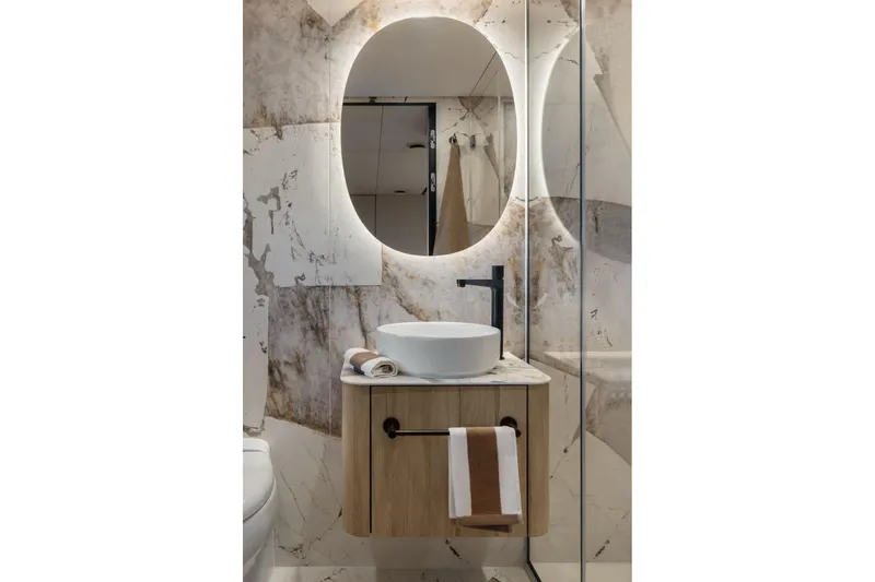 Slide: The Image of Luxurious bathroom in 2026 Moon Yachts 6ty, featuring modern sink and illuminated mirror. - 19