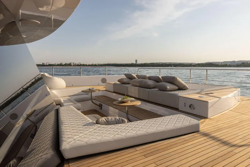 Slide: The Image of Luxurious deck of 2026 Moon Yachts 6ty with elegant seating and ocean view. - 2