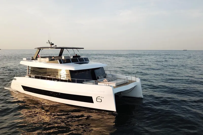 Slide: The Image of Luxury 2026 Moon Yachts 6ty cruising on open sea at sunset. - 29