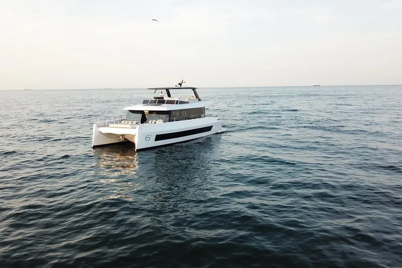 Slide: The Image of Luxury Moon Yachts 6ty 2026 model cruising on open sea. - 33