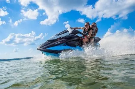Slide: The Image of 2025 Yamaha WaveRunner FX SVHO on water with two riders. - 9