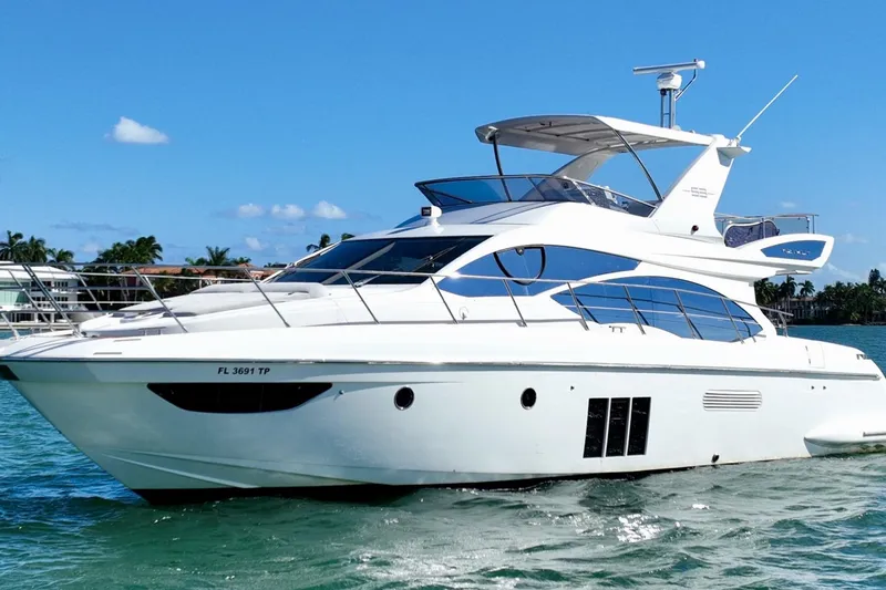 The Image of 2013 Azimut Fly 53 yacht cruising on clear blue waters. - 1