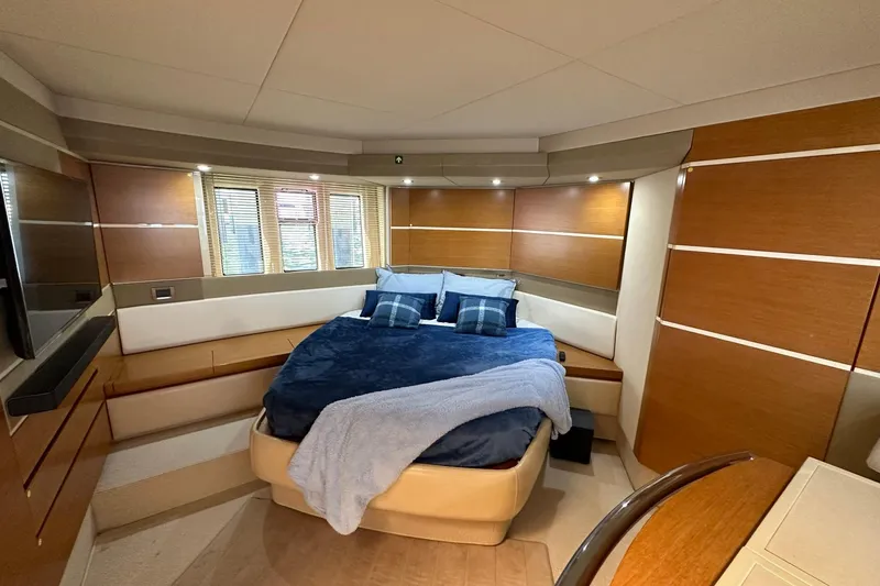 Slide: The Image of Luxurious bedroom interior of 2013 Azimut Fly 53 yacht with modern design and cozy bedding. - 12