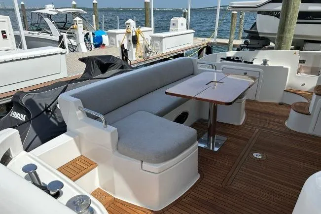 Slide: The Image of Azimut Fly 53 yacht 2013 model, featuring a spacious deck with seating and table. - 14