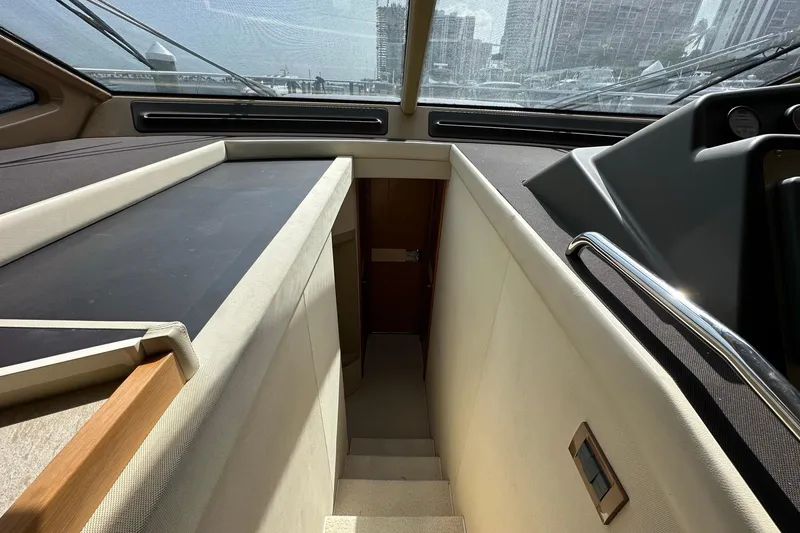 Slide: The Image of Interior view of 2013 Azimut Fly 53 yacht, featuring stairs and sleek design elements. - 21