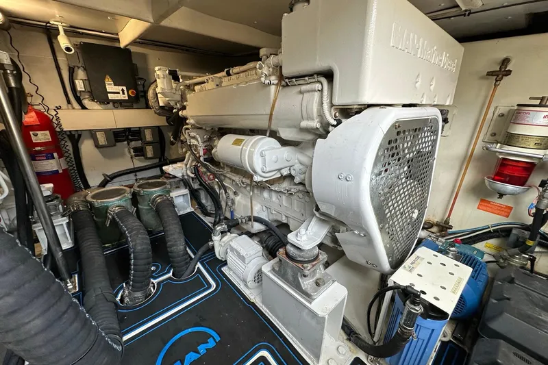 Slide: The Image of Engine room of 2013 Azimut Fly 53 yacht, featuring a MAN diesel engine. - 27