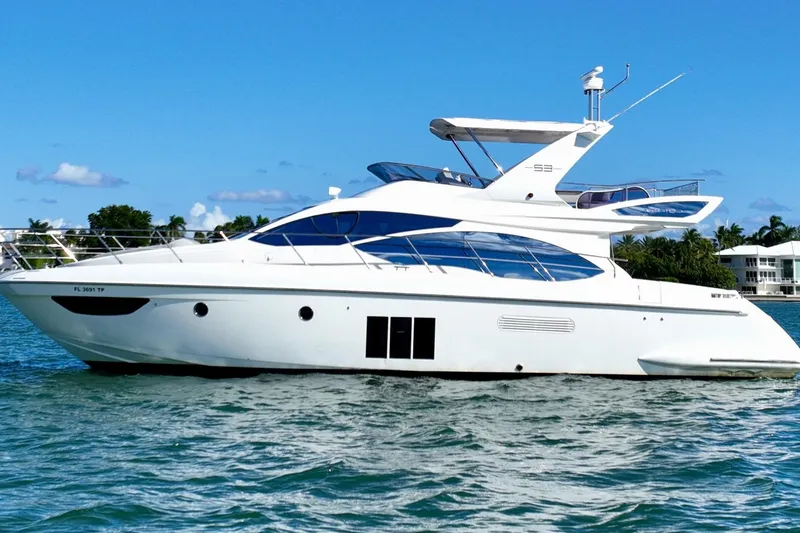 Slide: The Image of 2013 Azimut Fly 53 yacht cruising on clear blue waters. - 3