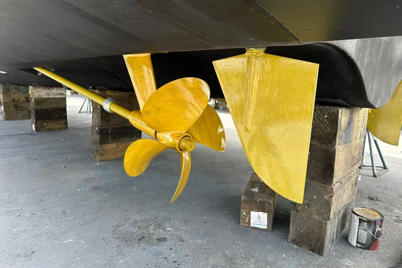 Slide: The Image of Yellow propeller and rudder of 2013 Azimut Fly 53 yacht on dry dock. - 33