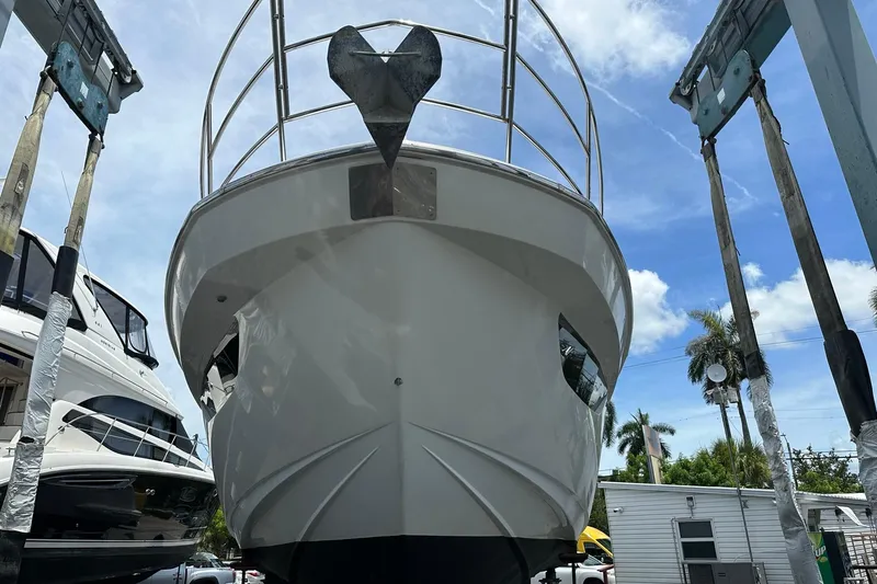 Slide: The Image of Azimut Fly 53 yacht from 2013 on a lift, under a clear blue sky. - 38