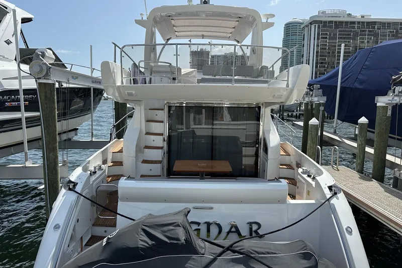 Slide: The Image of Luxury Azimut Fly 53 yacht docked at marina, showcasing elegant design and spacious deck. - 41