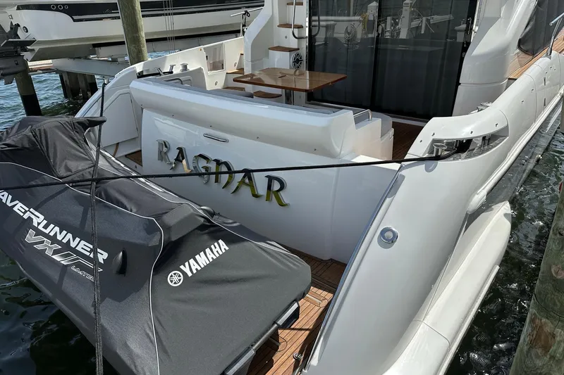 Slide: The Image of Azimut Fly 53 yacht from 2013 docked with Yamaha WaveRunner nearby. - 43