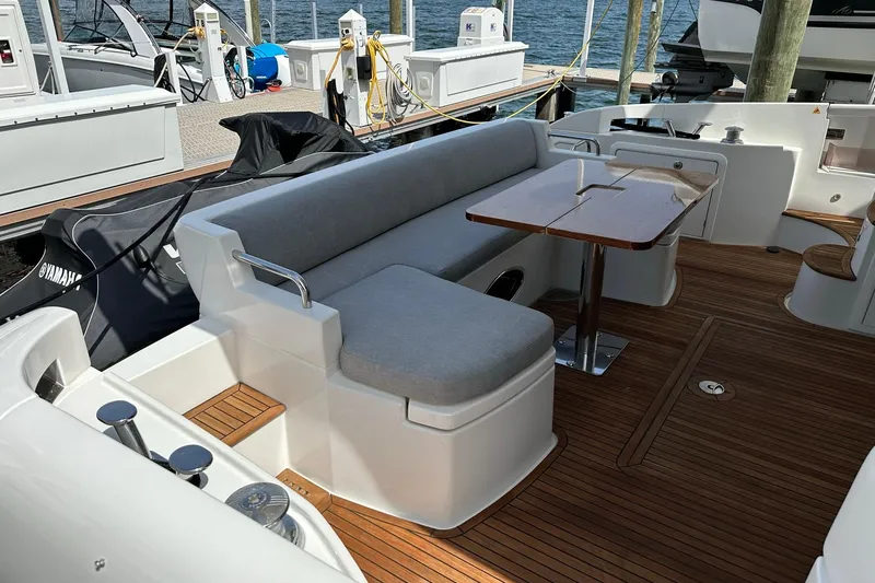 Slide: The Image of Azimut Fly 53 yacht 2013, featuring elegant deck seating and wooden flooring. - 44